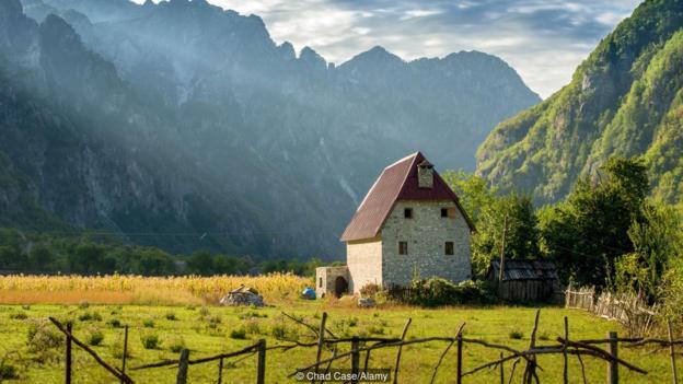EX7MBD Pavlin Polia's guest house in Theth, Albania at sunrise.